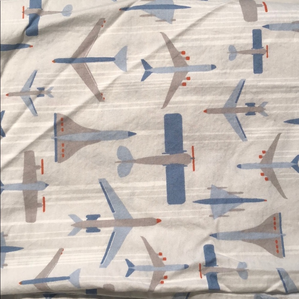 Blue airplane dwell studio crib skirt
